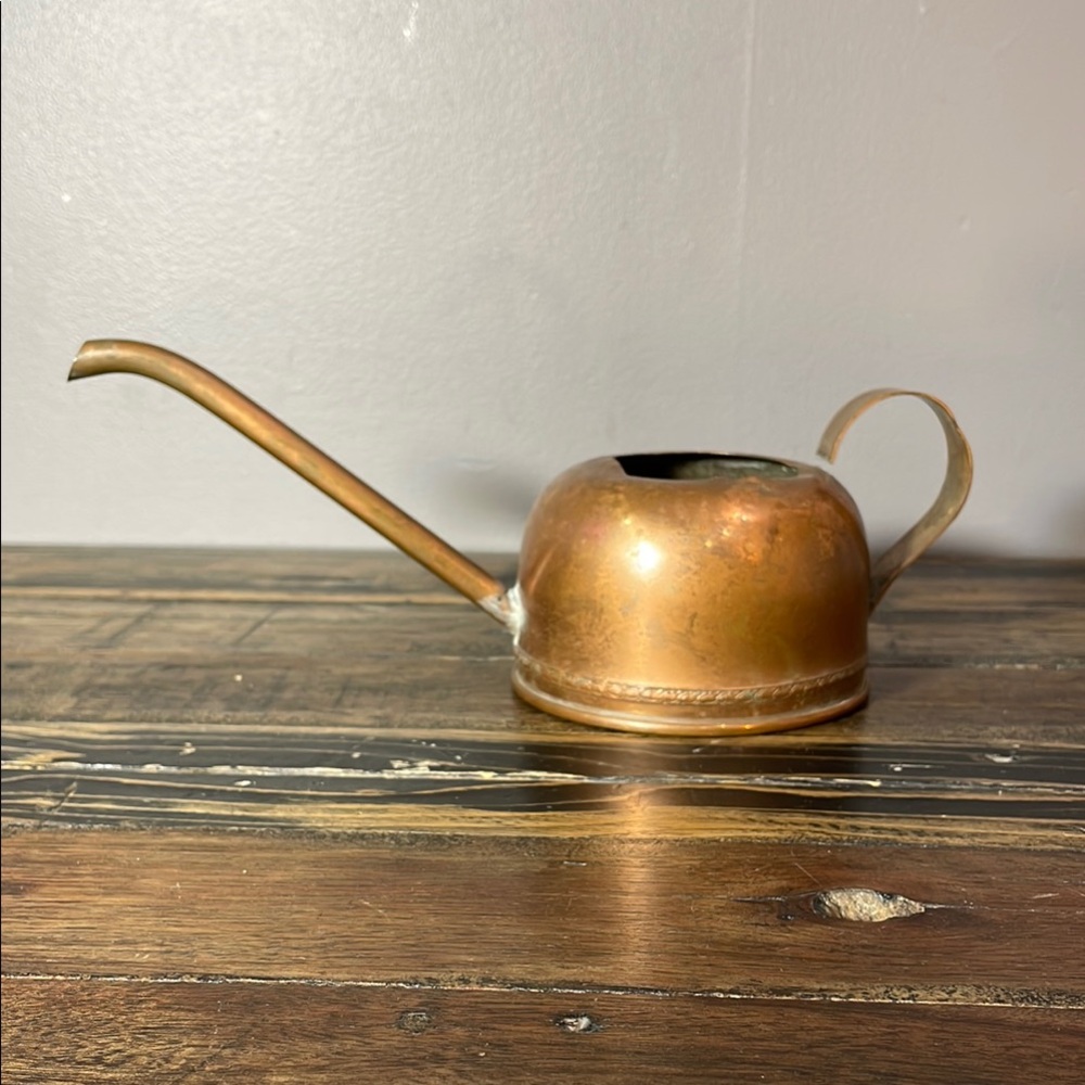 Vintage copper oil can with tiny pattern along base handle disconnected dents